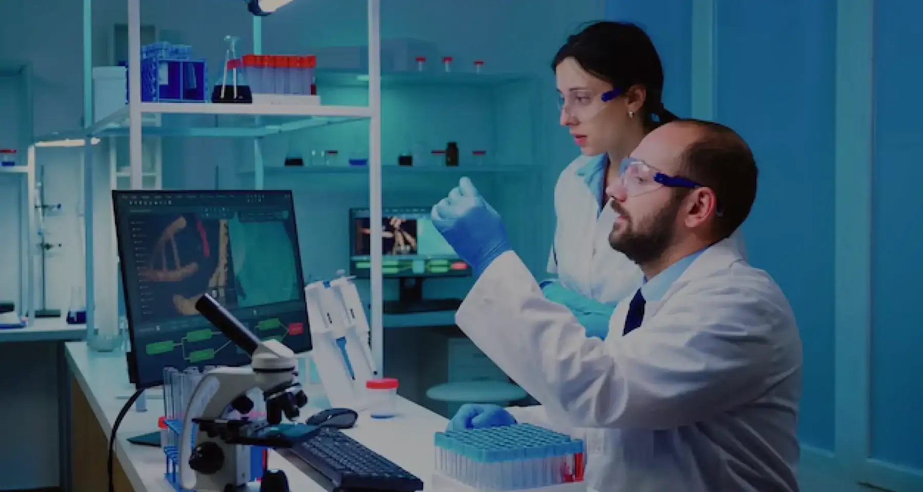 Scientists analyzing samples in a modern laboratory environment.